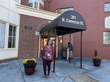 Sinclair Health Clinic Executive Director Mercedes Abbet stands in front of her clinic. Sinclair is conveniently located at 301 N. Cameron Street, in the Shockey Building.